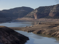 Hundreds of people are visiting the old town of Sant Roma de Sau, where normally the water of the Sau reservoir would almost completely cove...