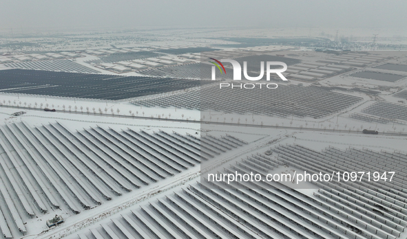 A new energy photovoltaic base is seen covered in snow in Suqian, Jiangsu Province, China, on February 5, 2024. 