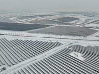 A new energy photovoltaic base is seen covered in snow in Suqian, Jiangsu Province, China, on February 5, 2024. (