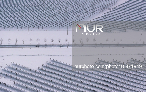 A new energy photovoltaic base is seen covered in snow in Suqian, Jiangsu Province, China, on February 5, 2024. 