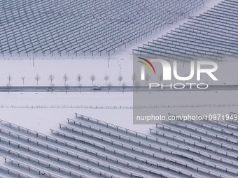 A new energy photovoltaic base is seen covered in snow in Suqian, Jiangsu Province, China, on February 5, 2024. (