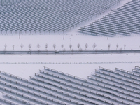 A new energy photovoltaic base is seen covered in snow in Suqian, Jiangsu Province, China, on February 5, 2024. (