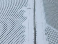 A new energy photovoltaic base is seen covered in snow in Suqian, Jiangsu Province, China, on February 5, 2024. (