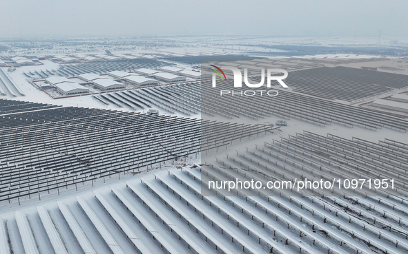 A new energy photovoltaic base is seen covered in snow in Suqian, Jiangsu Province, China, on February 5, 2024. 