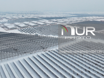 A new energy photovoltaic base is seen covered in snow in Suqian, Jiangsu Province, China, on February 5, 2024. (