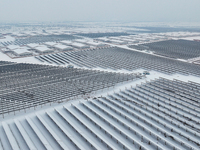 A new energy photovoltaic base is seen covered in snow in Suqian, Jiangsu Province, China, on February 5, 2024. (