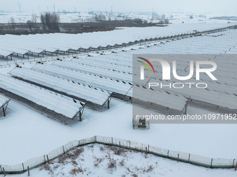 A new energy photovoltaic base is seen covered in snow in Suqian, Jiangsu Province, China, on February 5, 2024. (