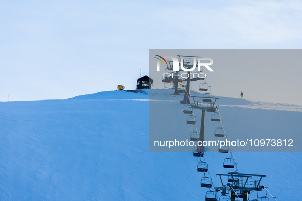 People skiing near Cortina d’Ampezzo, Italy, on February 4, 2024. A mild winter across Europe has resulted in several ski slopes being left...