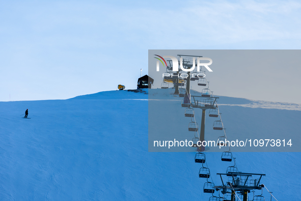 People skiing near Cortina d’Ampezzo, Italy, on February 4, 2024. A mild winter across Europe has resulted in several ski slopes being left...