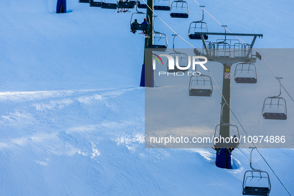 People skiing near Cortina d’Ampezzo, Italy, on February 4, 2024. A mild winter across Europe has resulted in several ski slopes being left...