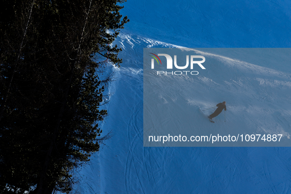 People skiing near Cortina d’Ampezzo, Italy, on February 4, 2024. A mild winter across Europe has resulted in several ski slopes being left...