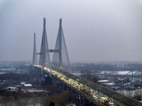 A large number of vehicles are traveling slowly on the section of the Huaian Bridge on the Changzhou-Shenzhen Expressway in Huai'an, China,...