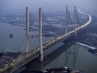 A large number of vehicles are traveling slowly on the section of the Huaian Bridge on the Changzhou-Shenzhen Expressway in Huai'an, China,...