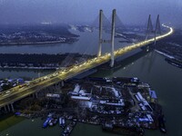 A large number of vehicles are traveling slowly on the section of the Huaian Bridge on the Changzhou-Shenzhen Expressway in Huai'an, China,...