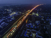 A large number of vehicles are traveling slowly on the section of the Huaian Bridge on the Changzhou-Shenzhen Expressway in Huai'an, China,...