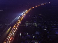 A large number of vehicles are traveling slowly on the section of the Huaian Bridge on the Changzhou-Shenzhen Expressway in Huai'an, China,...