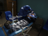 A child is receiving pediatric dental care as part of Dentist Day in Mexico at the Carlos A. Carrilo Elementary School in the Portales neigh...