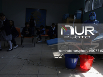 A child is receiving pediatric dental care as part of Dentist Day in Mexico at the Carlos A. Carrilo Elementary School in the Portales neigh...