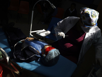 A child is receiving pediatric dental care as part of Dentist Day in Mexico at the Carlos A. Carrilo Elementary School in the Portales neigh...