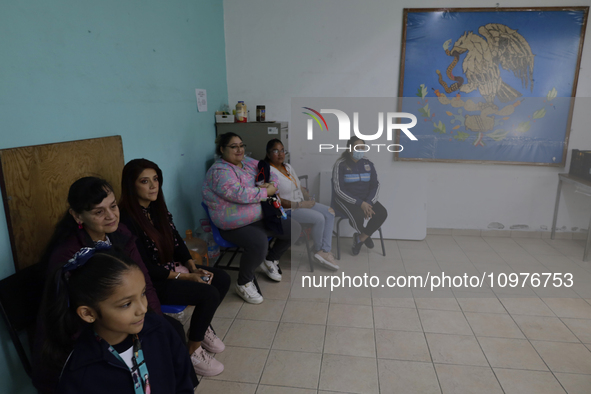 Girls and boys from basic education are waiting with their mothers and fathers to receive pediatric dental care in celebration of Dentist's...