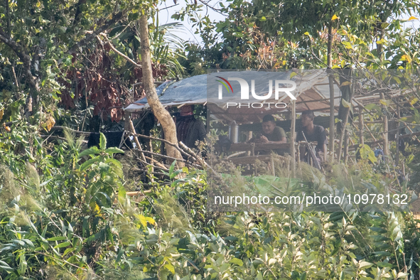 Members of the Arakan Rebel Group are being seen from Naikhongchori, a former Myanmar Border Guard Police (BGP) post, after the Myanmar BGP...