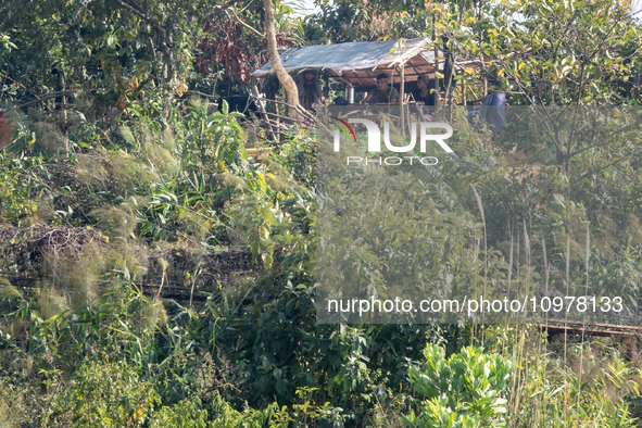 Members of the Arakan Rebel Group are being seen from Naikhongchori, a former Myanmar Border Guard Police (BGP) post, after the Myanmar BGP...