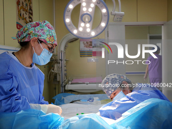 Medical staff and family members are accompanying a woman who is giving birth at the Maternal and Child Health Hospital in Zaozhuang, Shando...