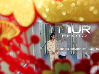 A woman is waiting for delivery accompanied by medical staff at the Maternal and Child Health Hospital in Zaozhuang, Shandong Province, Chin...