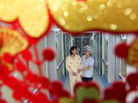 A woman is waiting for delivery accompanied by medical staff at the Maternal and Child Health Hospital in Zaozhuang, Shandong Province, Chin...