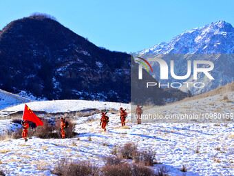 Firefighters are patrolling the forest grassland protection in Zhangye, China, on February 10, 2024. (