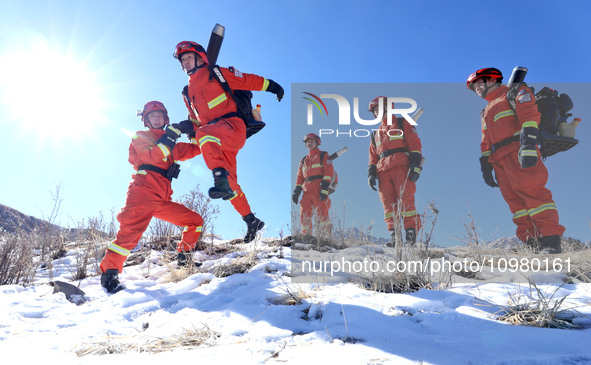 Firefighters are crossing a ditch to patrol forest grassland protection in Zhangye, China, on February 10, 2024. 