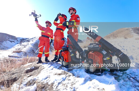 Firefighters are using drones to observe forest grassland protection in Zhangye, China, on February 10, 2024. 