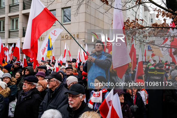 A crowd of people, holding Polish national flags, led by far right media - Gazeta Polska and TV Republica and Law and Justice (Prawo i Spraw...