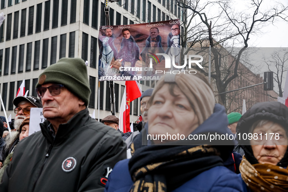 A crowd of people, holding Polish national flags and anti-government banners, led by far right media - Gazeta Polska and TV Republica and La...