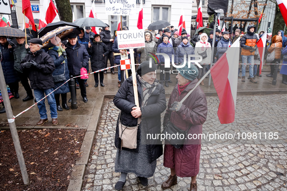 People, holding Polish national flags and anti-government banners, led by far right media - Gazeta Polska and TV Republica and Law and Justi...