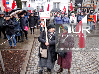 People, holding Polish national flags and anti-government banners, led by far right media - Gazeta Polska and TV Republica and Law and Justi...