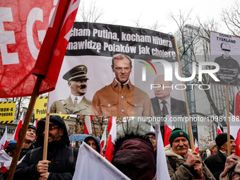 A crowd of people, holding Polish national flags and anti-government banners, led by far right media - Gazeta Polska and TV Republica and La...