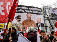 A crowd of people, holding Polish national flags and anti-government banners, led by far right media - Gazeta Polska and TV Republica and La...