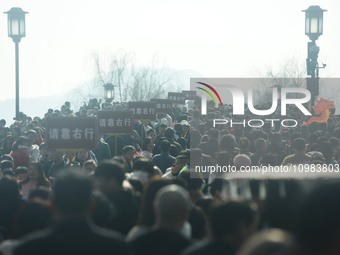 People are crowding on the broken West Lake Bridge in Hangzhou, Zhejiang Province, China, on February 11, 2024. (