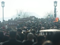 People are crowding on the broken West Lake Bridge in Hangzhou, Zhejiang Province, China, on February 11, 2024. (