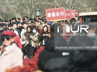 People are crowding on the broken West Lake Bridge in Hangzhou, Zhejiang Province, China, on February 11, 2024. (