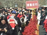 People are crowding on the broken West Lake Bridge in Hangzhou, Zhejiang Province, China, on February 11, 2024. (