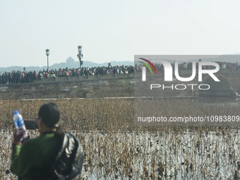 People are crowding on the broken West Lake Bridge in Hangzhou, Zhejiang Province, China, on February 11, 2024. (