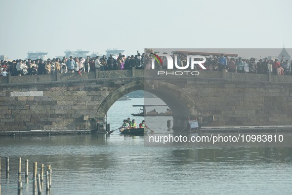 People are crowding on the broken West Lake Bridge in Hangzhou, Zhejiang Province, China, on February 11, 2024. 