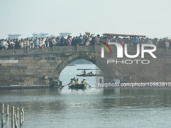 People are crowding on the broken West Lake Bridge in Hangzhou, Zhejiang Province, China, on February 11, 2024. (