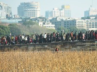 People are crowding on the broken West Lake Bridge in Hangzhou, Zhejiang Province, China, on February 11, 2024. (