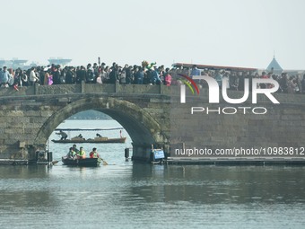 People are crowding on the broken West Lake Bridge in Hangzhou, Zhejiang Province, China, on February 11, 2024. (