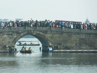 People are crowding on the broken West Lake Bridge in Hangzhou, Zhejiang Province, China, on February 11, 2024. (