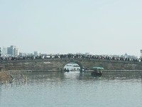 People are crowding on the broken West Lake Bridge in Hangzhou, Zhejiang Province, China, on February 11, 2024. (