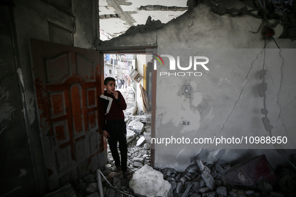 Palestinians are inspecting the damage caused by Israeli bombardment in Deir al-Balah, central Gaza Strip, on February 12, 2024, as battles...